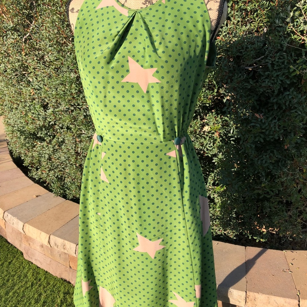 Green dress with stars and polka-dots.